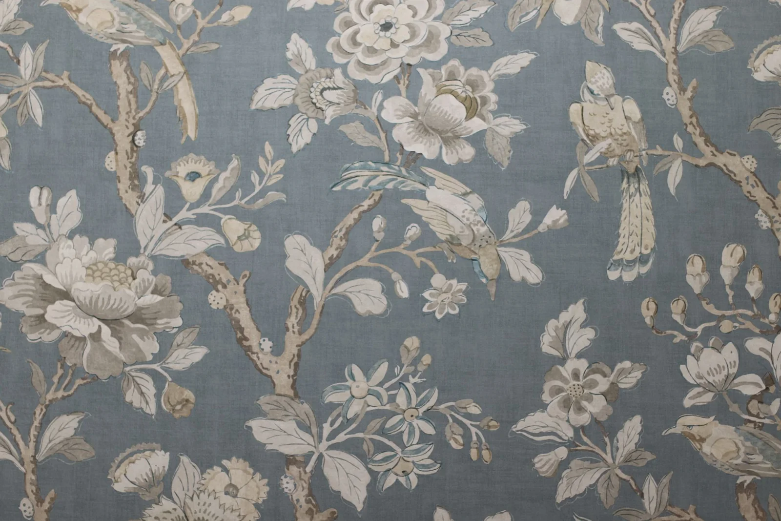 Before: the same frame as shot — a flat grey-blue floral textile